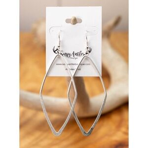 Beautiful burnished silver earrings feature large diamond-shaped design